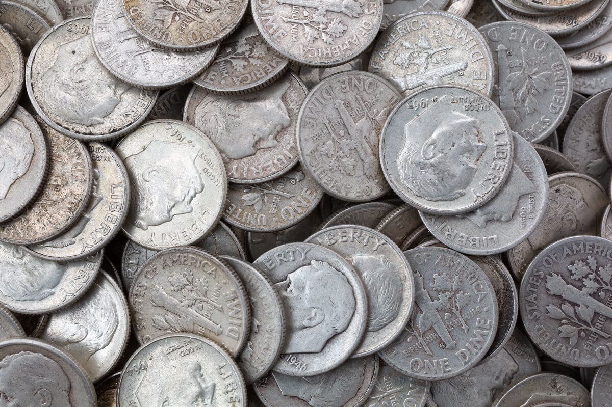 Very close view of old silver dimes illuminated with natural light