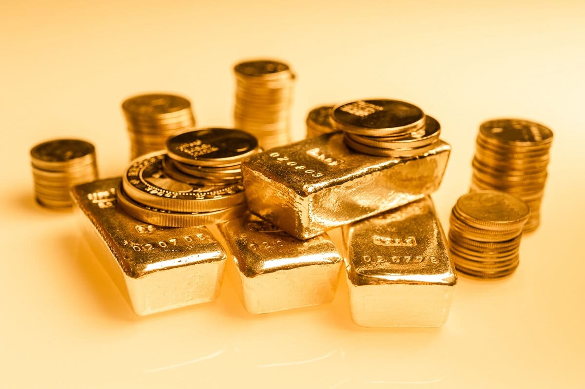 Gold bars and stack of gold coins